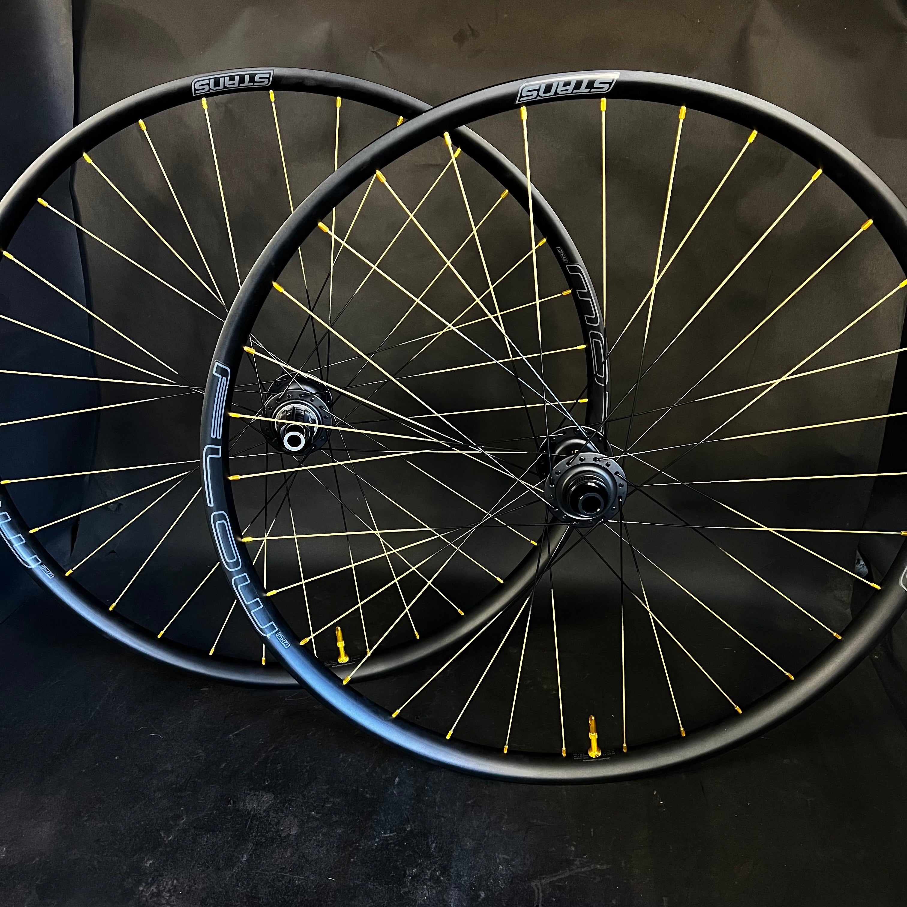 Trail: Gold Tipped Flow MK4 29” rims on Chris King Hubs