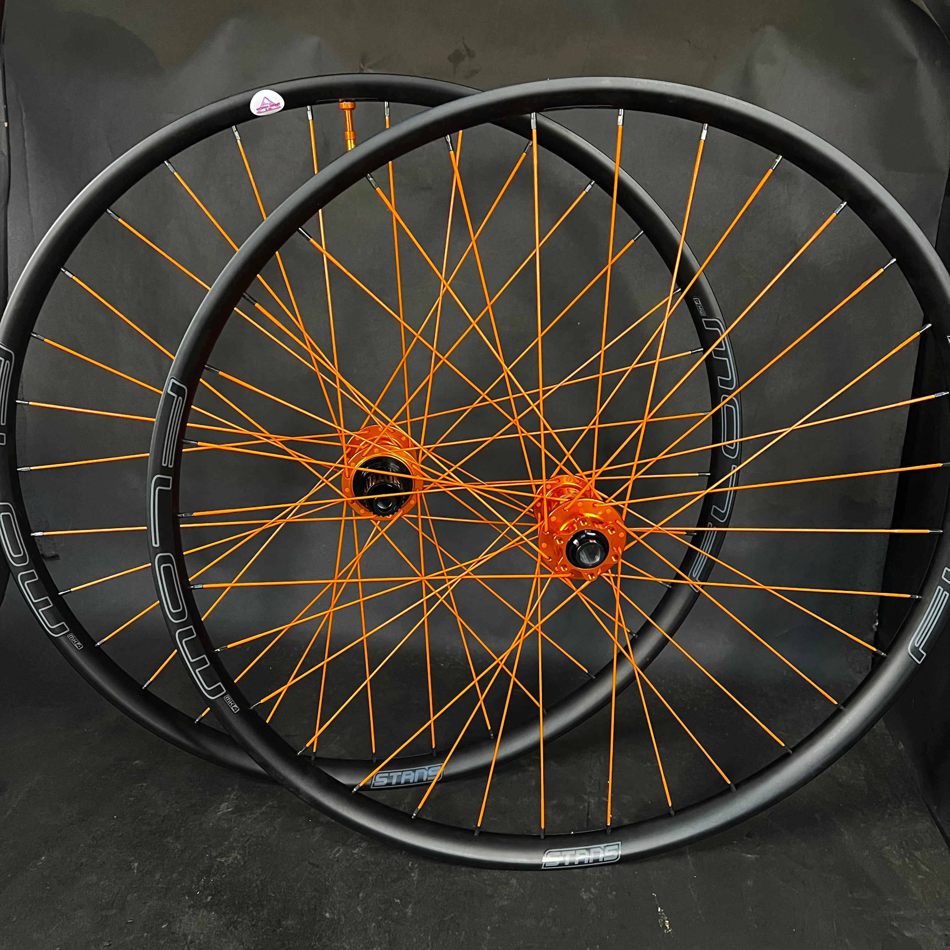 Trail: Full Orange Flow MK4 rims W/ Hydra 2 Boost hubs
